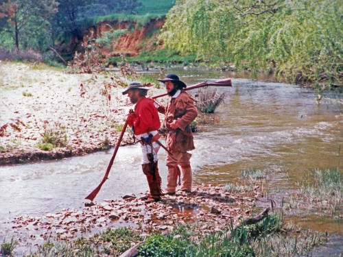 Old Injun and Glen Mitchell checking the creek banks for sign.