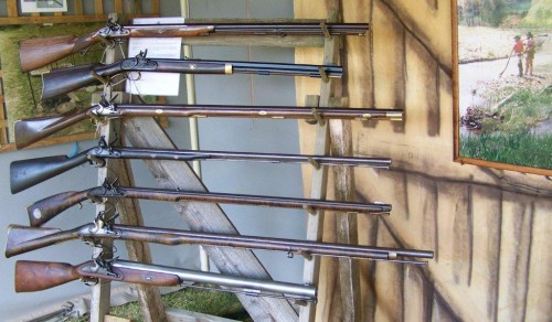 Gun rack of flintlocks on display at Seymour Expo.  Photo by Jim Walker.